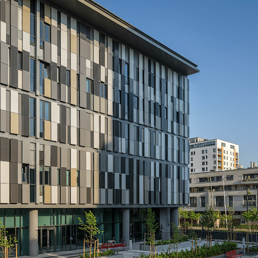 A modern high-rise building with an aluminum composite panel curtain wall, featuring a sleek metallic finish that enhances both aesthetics and energy efficiency